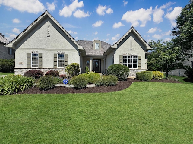 807 Wedgewood Ct, Lindenhurst, IL 60046 - view of front of home with a front yard, stone siding, and stucco siding