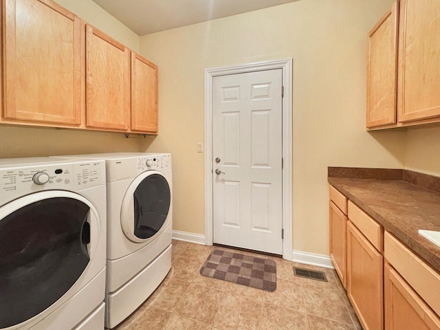 807 Wedgewood Ct, Lindenhurst, IL 60046 - laundry area featuring washer and dryer, cabinet space, and light tile patterned floors