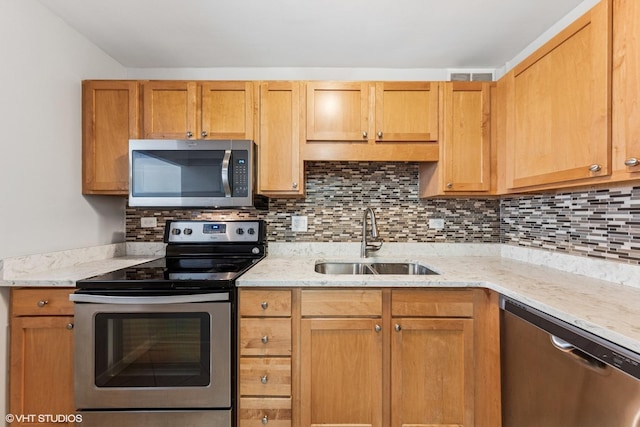 211 E Ohio St Unit 1825, Chicago, IL 60611 - kitchen featuring stainless steel appliances, decorative backsplash, and light stone countertops
