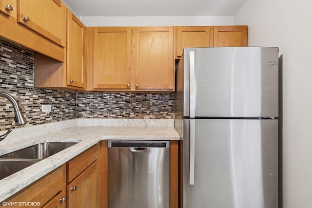 211 E Ohio St Unit 1825, Chicago, IL 60611 - kitchen with appliances with stainless steel finishes, backsplash, and light stone counters