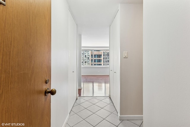 211 E Ohio St Unit 1825, Chicago, IL 60611 - corridor featuring light tile patterned floors and baseboards