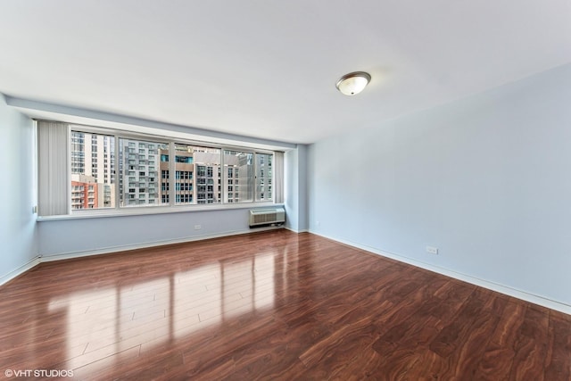 211 E Ohio St Unit 1825, Chicago, IL 60611 - spare room with wood finished floors and a wall mounted AC