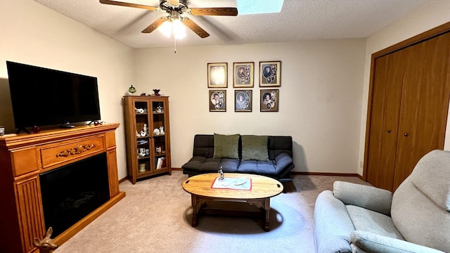 500 Jenkran Way Unit 2, Morrison, IL 61270 - living room featuring light colored carpet, ceiling fan, a fireplace, and a textured ceiling