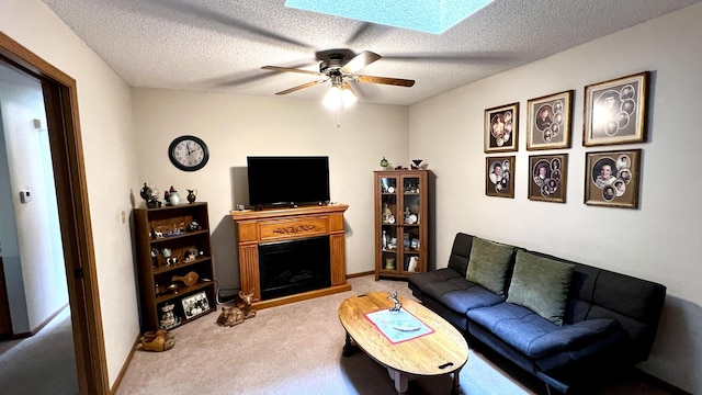 500 Jenkran Way Unit 2, Morrison, IL 61270 - living area with carpet flooring, a skylight, a fireplace, a ceiling fan, and a textured ceiling