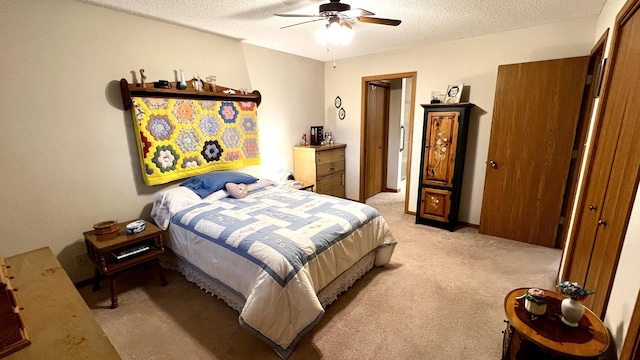 500 Jenkran Way Unit 2, Morrison, IL 61270 - bedroom with light colored carpet, a textured ceiling, and ceiling fan
