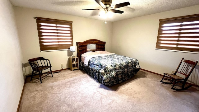 500 Jenkran Way Unit 2, Morrison, IL 61270 - carpeted bedroom with a textured ceiling and a ceiling fan