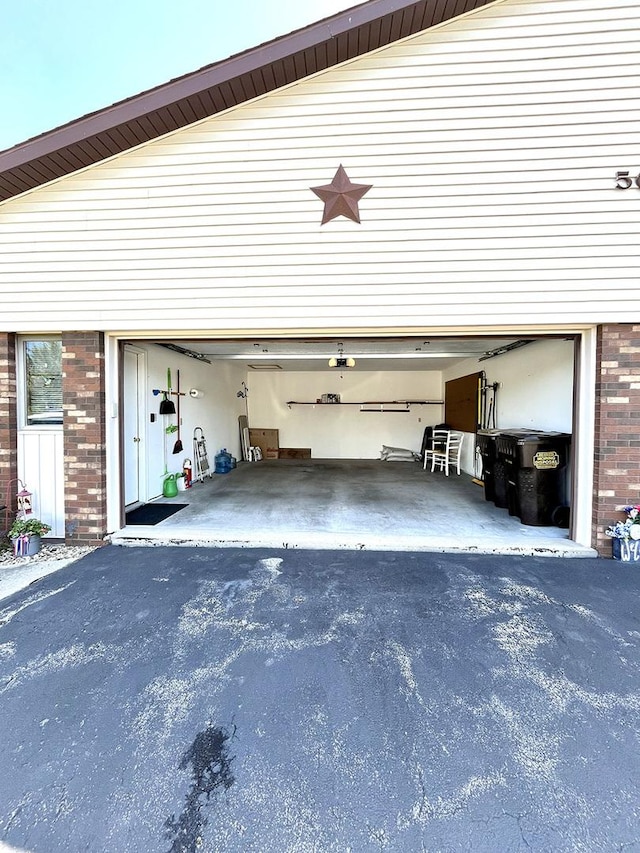 500 Jenkran Way Unit 2, Morrison, IL 61270 - garage featuring driveway