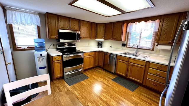 500 Jenkran Way Unit 2, Morrison, IL 61270 - kitchen with stainless steel appliances, light wood-type flooring, light countertops, and brown cabinets