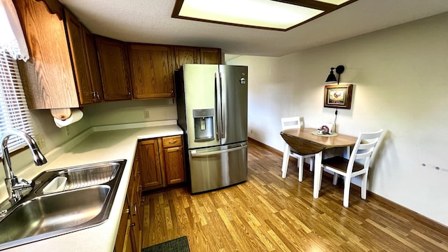 500 Jenkran Way Unit 2, Morrison, IL 61270 - kitchen with stainless steel fridge with ice dispenser, light wood-style flooring, and light countertops