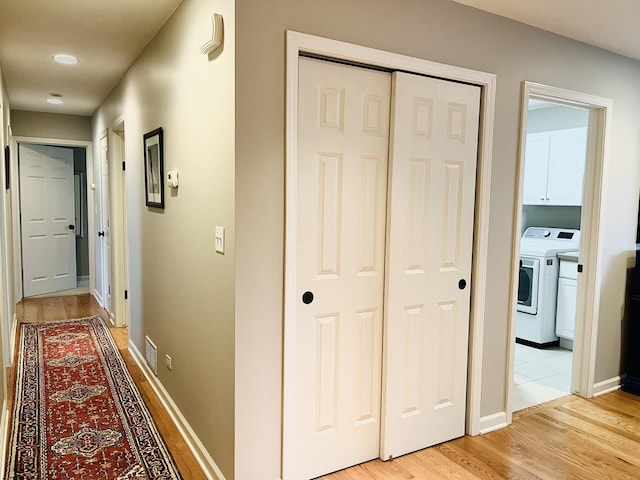 441 Highland Ave, Crystal Lake, IL 60014 - corridor featuring washer / dryer and light wood-style flooring