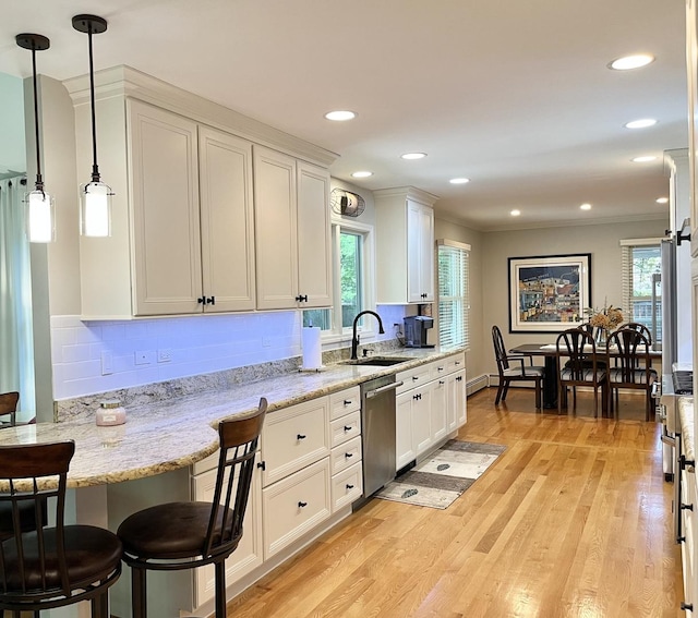 441 Highland Ave, Crystal Lake, IL 60014 - kitchen with stainless steel dishwasher, plenty of natural light, white cabinets, and recessed lighting