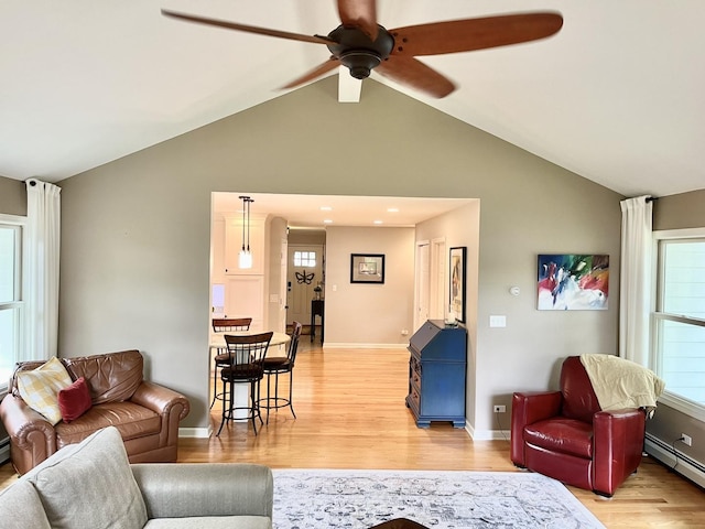441 Highland Ave, Crystal Lake, IL 60014 - living area featuring ceiling fan, light wood-type flooring, baseboard heating, and high vaulted ceiling