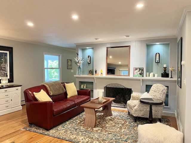 441 Highland Ave, Crystal Lake, IL 60014 - living room with ornamental molding, light wood-style floors, a brick fireplace, a baseboard heating unit, and recessed lighting