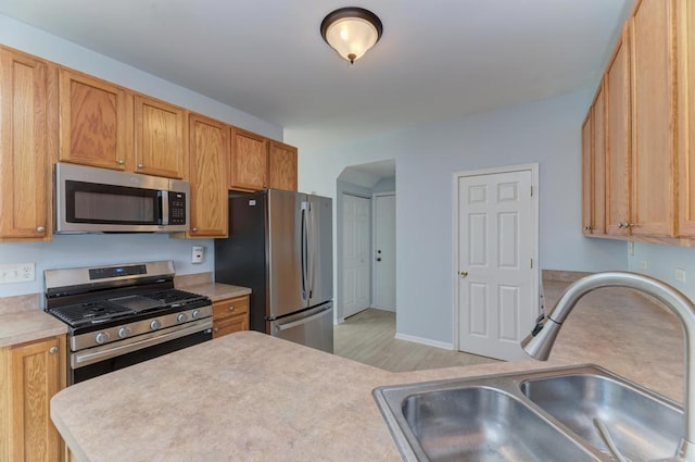 24341 Leski Ln, Plainfield, IL 60585 - kitchen with appliances with stainless steel finishes, light countertops, and light wood-style floors
