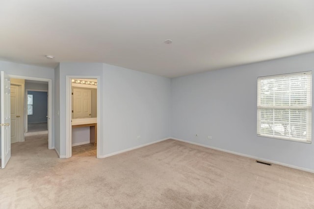 24341 Leski Ln, Plainfield, IL 60585 - empty room featuring light colored carpet and baseboards
