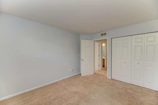 24341 Leski Ln, Plainfield, IL 60585 - unfurnished bedroom featuring light carpet and a closet