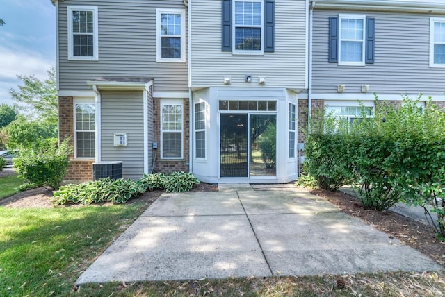 24341 Leski Ln, Plainfield, IL 60585 - back of property with a patio and brick siding