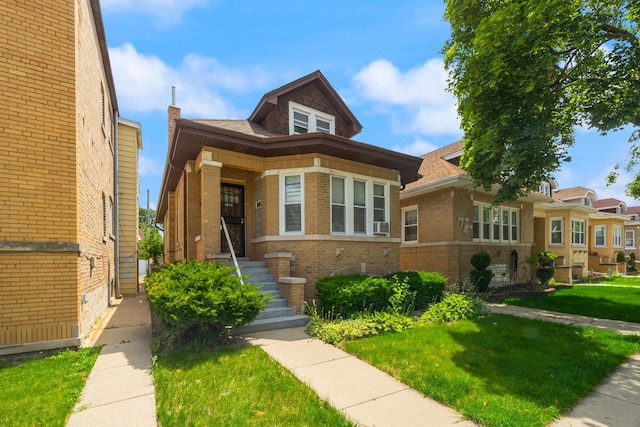 2955 N Lotus Ave, Chicago, IL 60641 - bungalow-style house featuring brick siding and a front lawn