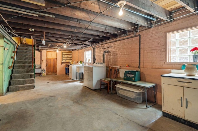2955 N Lotus Ave, Chicago, IL 60641 - basement featuring washing machine and clothes dryer, stairway, and brick wall