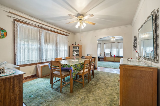 2955 N Lotus Ave, Chicago, IL 60641 - dining room with ceiling fan, arched walkways, and ornamental molding