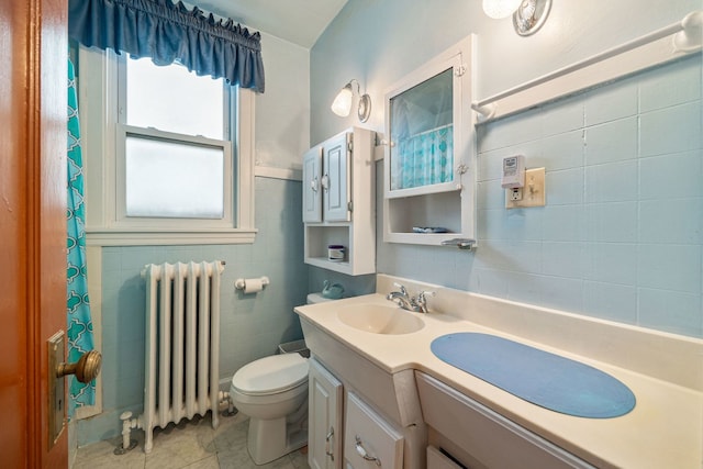 2955 N Lotus Ave, Chicago, IL 60641 - full bath with radiator, tile walls, and vanity