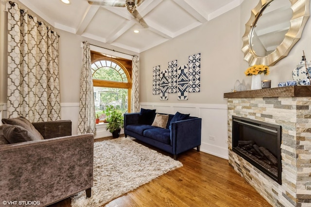 4456 S Berkeley Ave, Chicago, IL 60653 - living area featuring coffered ceiling, a wainscoted wall, wood finished floors, a glass covered fireplace, and beamed ceiling