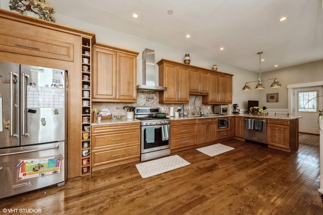 4456 S Berkeley Ave, Chicago, IL 60653 - kitchen featuring stainless steel appliances, wall chimney range hood, dark wood-style floors, a peninsula, and backsplash