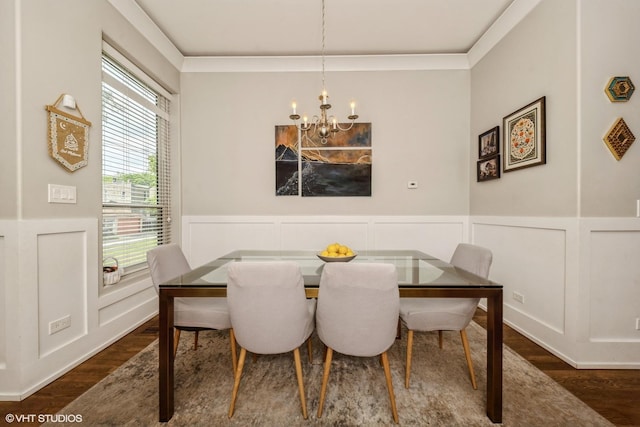 4456 S Berkeley Ave, Chicago, IL 60653 - dining space with a chandelier, dark wood-style flooring, a decorative wall, wainscoting, and crown molding