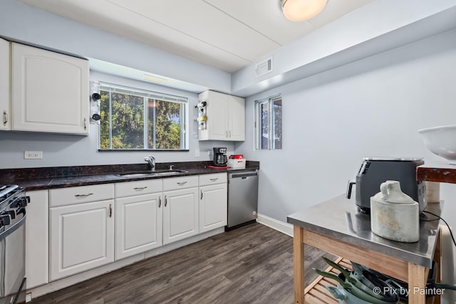 61 W Pier Dr Unit 201, Westmont, IL 60559 - kitchen with dishwasher, stove, white cabinets, dark wood-style floors, and dark stone counters