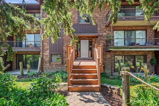 61 W Pier Dr Unit 201, Westmont, IL 60559 - view of front of property with a balcony and brick siding