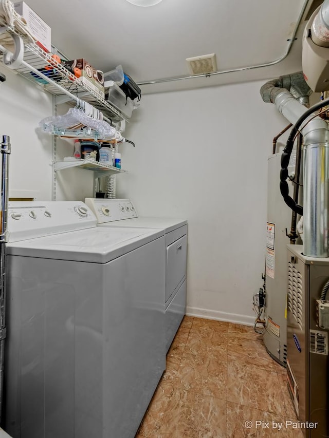 61 W Pier Dr Unit 201, Westmont, IL 60559 - laundry room featuring independent washer and dryer and gas water heater