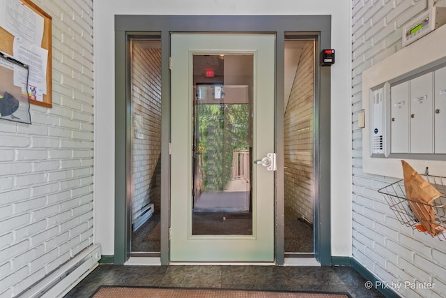 61 W Pier Dr Unit 201, Westmont, IL 60559 - property entrance with baseboard heating and brick siding
