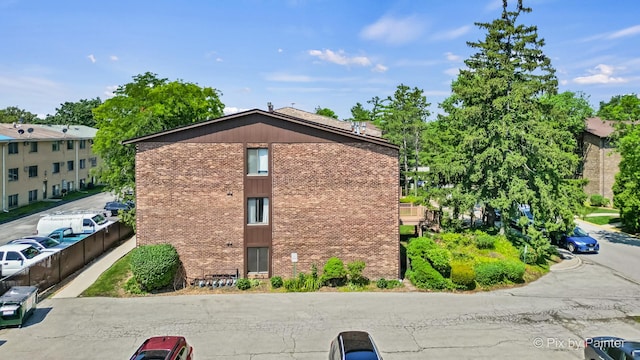 61 W Pier Dr Unit 201, Westmont, IL 60559 - view of property exterior featuring brick siding
