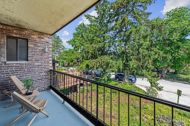 61 W Pier Dr Unit 201, Westmont, IL 60559 - balcony with view of wooded area