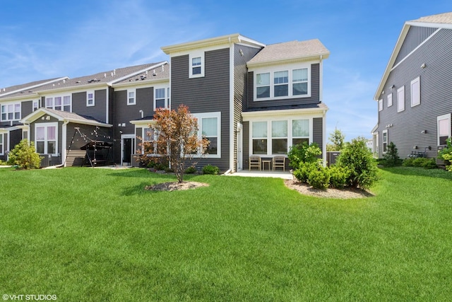 24518 W Alexis Ln, Plainfield, IL 60585 - rear view of house featuring a lawn and a patio area