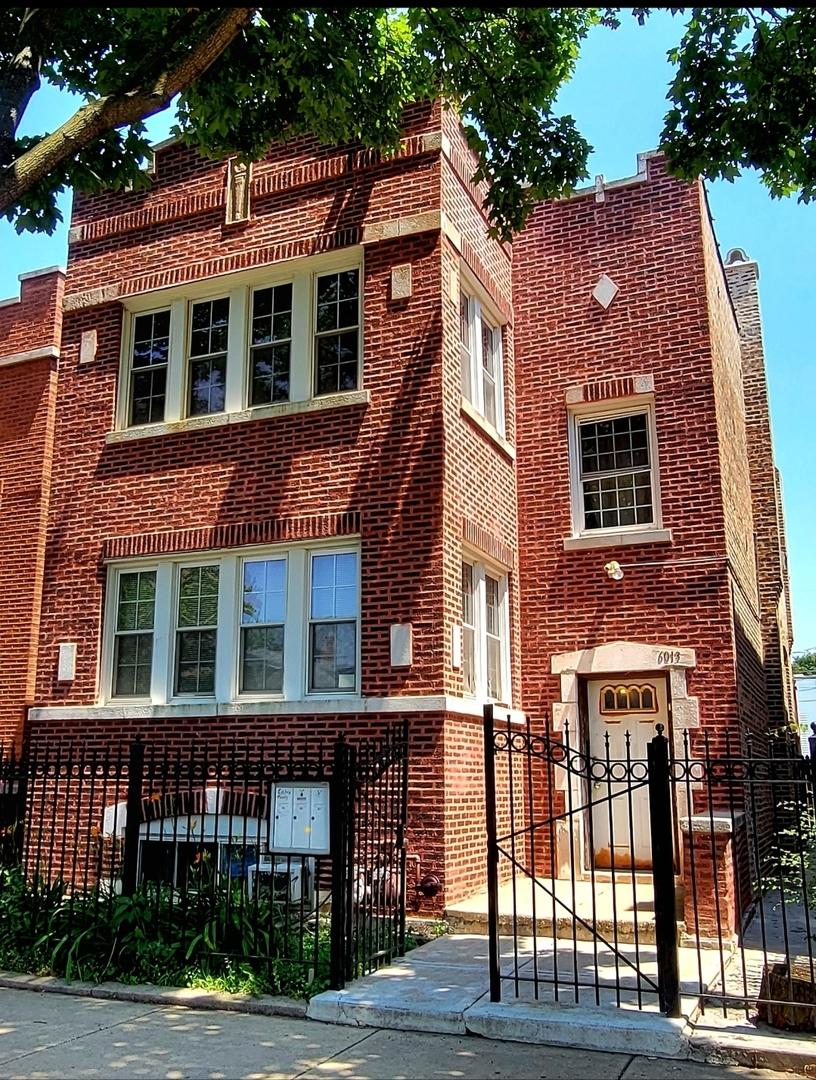 6013 S Troy St, Chicago, IL 60629 - view of front of property with a fenced front yard and brick siding