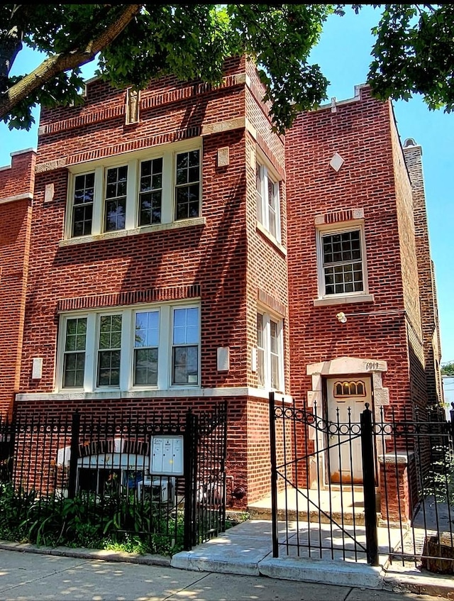 6013 S Troy St, Chicago, IL 60629 - view of front of property with a fenced front yard and brick siding