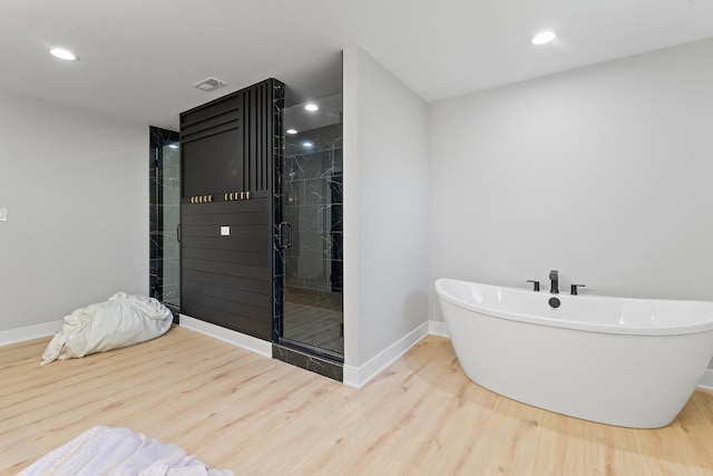 25216 S Channault Ave, Monee, IL 60449 - bathroom with wood finished floors, a freestanding tub, a stall shower, and recessed lighting