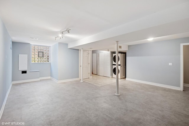 2543 Crawford Ave, Evanston, IL 60201 - basement featuring stacked washing machine and dryer and baseboards