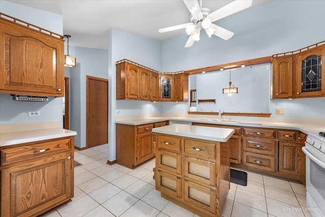 81 Castle Rock Ln, Bloomingdale, IL 60108 - kitchen featuring brown cabinets, white range, light countertops, and glass insert cabinets