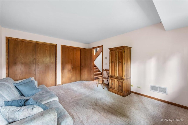 81 Castle Rock Ln, Bloomingdale, IL 60108 - living area with carpet flooring and stairs