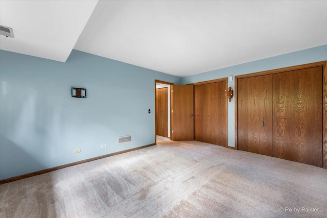 81 Castle Rock Ln, Bloomingdale, IL 60108 - unfurnished bedroom with carpet and multiple closets