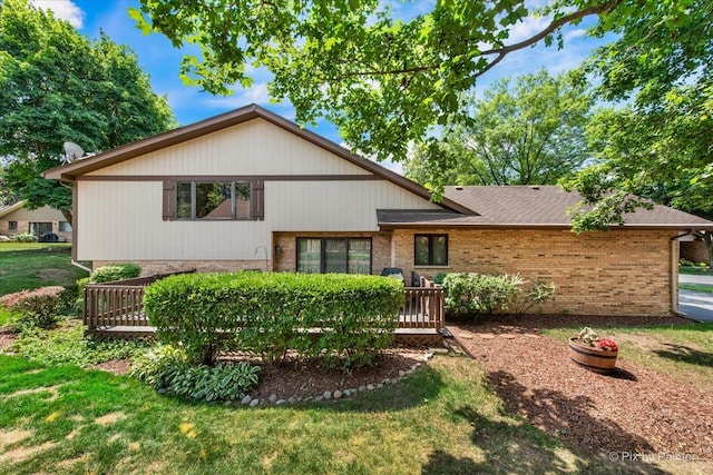 81 Castle Rock Ln, Bloomingdale, IL 60108 - split level home featuring brick siding, a deck, and a front yard