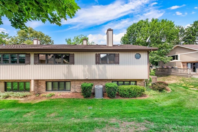 81 Castle Rock Ln, Bloomingdale, IL 60108 - view of front of property featuring a chimney, a front lawn, and brick siding