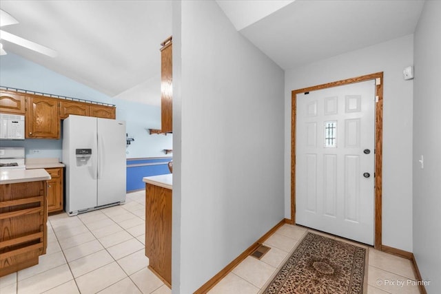 81 Castle Rock Ln, Bloomingdale, IL 60108 - entryway with lofted ceiling, light tile patterned floors, and a ceiling fan