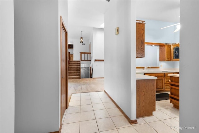 81 Castle Rock Ln, Bloomingdale, IL 60108 - corridor featuring light tile patterned floors, stairway, and light carpet