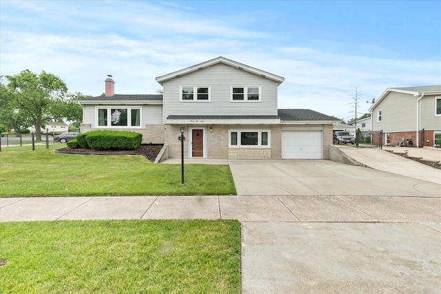 9160 S 88th Ct, Hickory Hills, IL 60457 - split level home with a garage, driveway, a chimney, and brick siding
