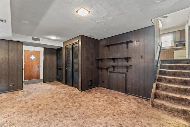 9160 S 88th Ct, Hickory Hills, IL 60457 - basement featuring wooden walls, carpet flooring, stairway, and a textured ceiling