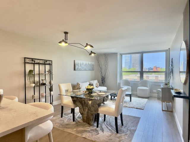 720 W Gordon Ter Unit 6J, Chicago, IL 60613 - dining space featuring wood finished floors and baseboards
