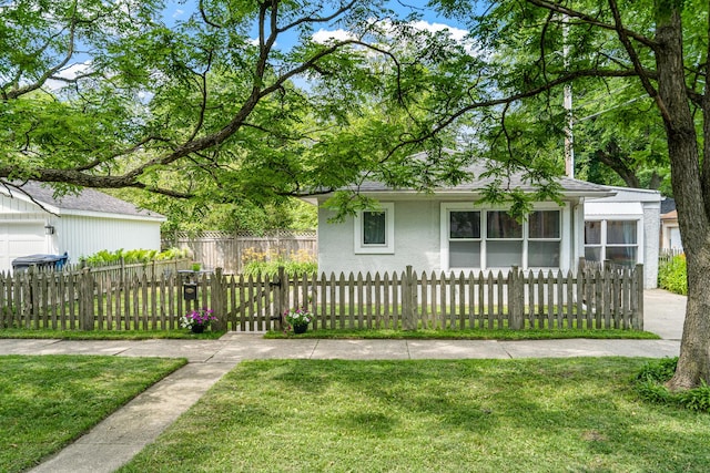 2222 Grey Ave, Evanston, IL 60201 - view of front facade featuring stucco siding and a fenced front yard